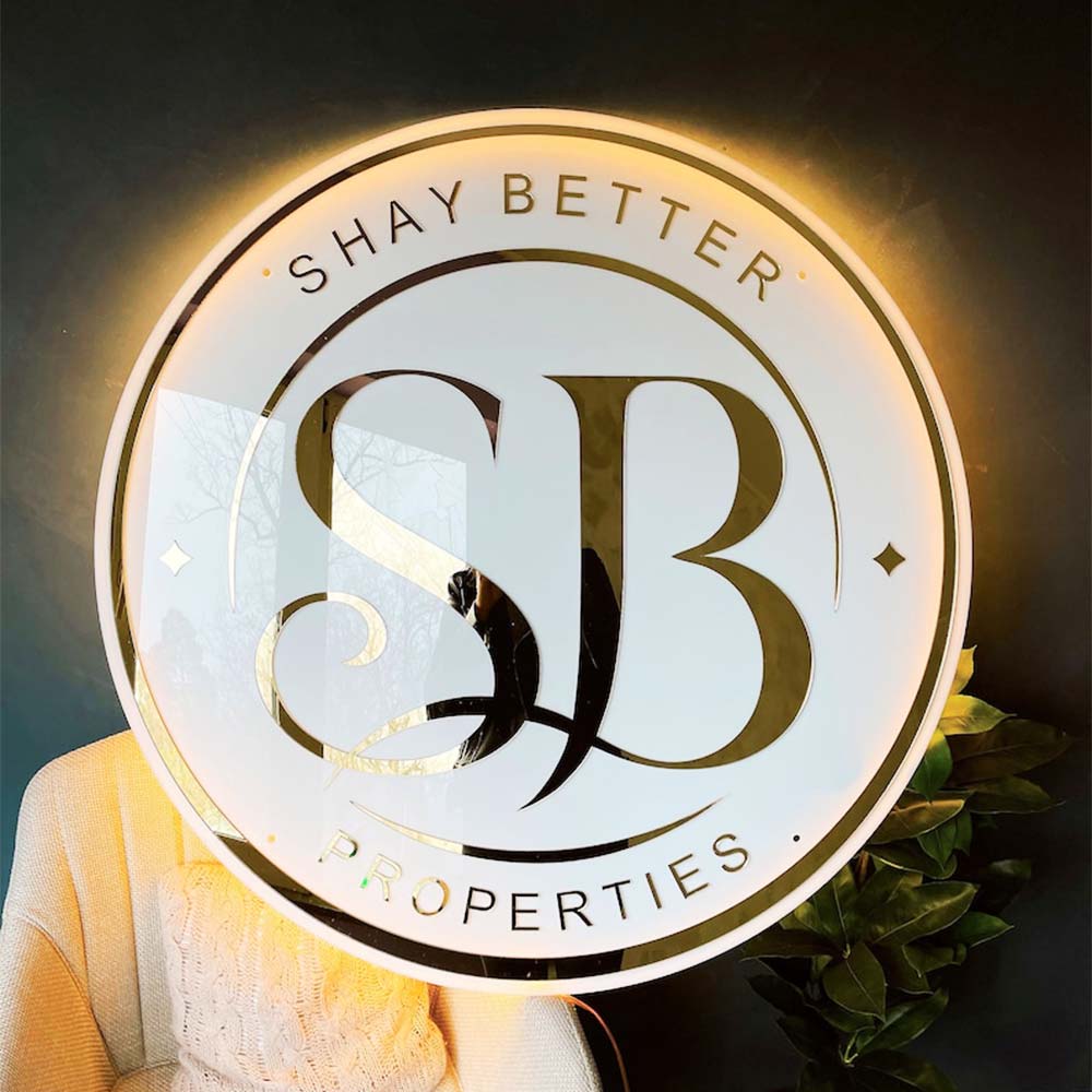 White custom acrylic sign with backlit gold 3D lettering - acrylic sign in Morocco